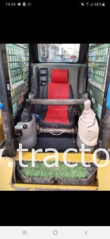 À vendre Chargeuse compacte avec godet Caterpillar 216 B3 ou à échanger contre tractopelle complet