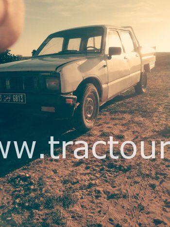 À vendre Camionnette 4 portes avec benne Isuzu KB 26 complet