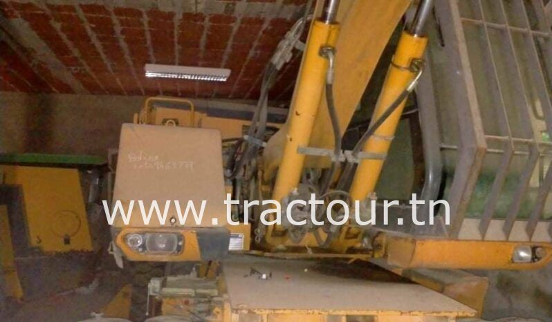 À vendre Pelle sur pneus avec brise roche Case complet