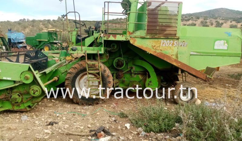 À vendre Moissonneuse batteuse à sacs بالشكارة Deutz-Fahr 1202 Super complet